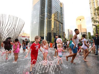 The Nancy Best Fountain in Klyde Warren Park is a splash pad by day, and it adds a colorful...
