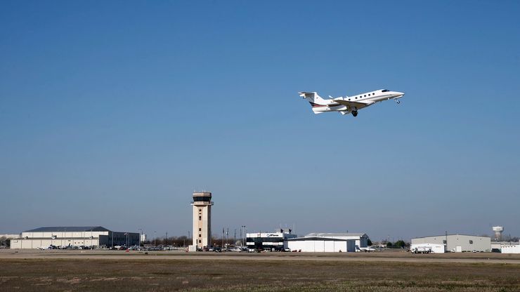 A general aviation plane takes off at McKinney National Airport in August 2019.